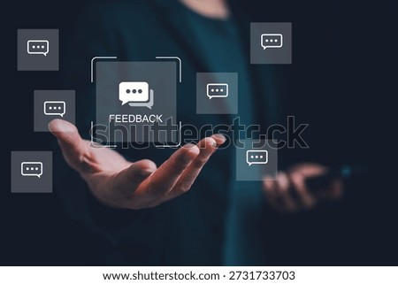Hand presenting digital feedback interface with chat icon, symbolizing customer feedback, user experience, review, engagement, satisfaction, business improvement through interactive feedback system.