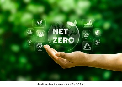 Hand presenting net zero globe with sustainability icons on green background, illustrating carbon reduction strategy, climate responsibility, renewable energy transition, and environmental governance