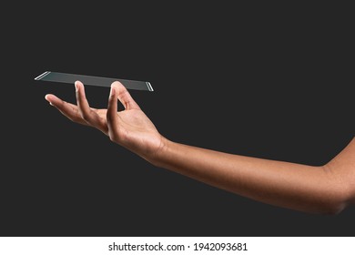 Hand presenting transparent phone futuristic technology