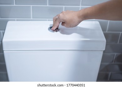 hand press and flush toilet. Cleaning, Lifestyle and personal hygiene concept - Shutterstock ID 1770440351