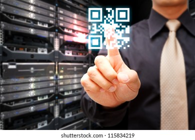 Hand press on QR code in server room