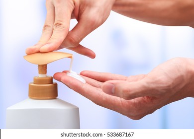 Hand Press Pump Head Shampoo Bottle With Blur Bathroom Background