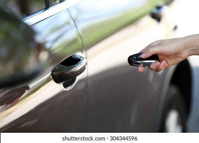 Hand Presses On Remote Control Car Alarm Systems