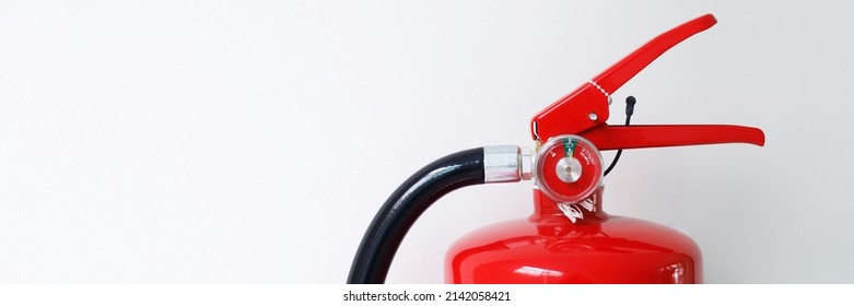 Hand Presses The Trigger Fire Extinguisher Available In Fire Emergencies Conflagration Damage Background. Safety