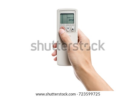 Hand pressing air conditioner remote control isolated on white background