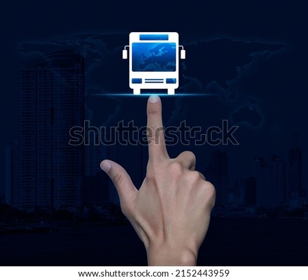 Hand pressing bus flat icon over world map, modern city tower and skyscraper, Business transportation service concept, Elements of this image furnished by NASA