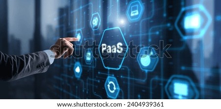Hand pressing button on interface PaaS, Platform as a Service. Internet and networking concept