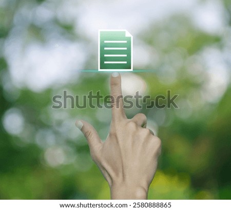 Hand pressing document flat icon over blur green tree in park, Technology internet online concept