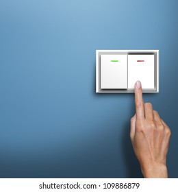 hand pressing electronic-light switch - Shutterstock ID 109886879