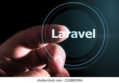 Hand pressing Laravel button on virtual screens. Laravel PHP Framework programming language. 