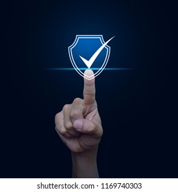 Hand Pressing Security Shield With Check Mark Icon Over Gradient Light Blue Background, Technology Computer And Internet Cyber Security And Anti Virus Concept
