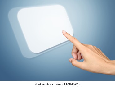 Hand pressing virtual button on blue background