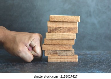 Hand Prevent Wooden Block Tower Stack Not Falling. Concept Of Prevention Of Financial Business And Risk Management Or Strategic Planning.