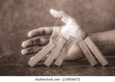 Hand Prevent Wooden Block Tower Stack Not Falling. Concept Of Prevention Of Financial Business And Risk Management Or Strategic Planning.