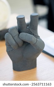 Hand printed on a 3D printer from polyamide powder. Three-dimensiona model of a human hand created on a 3D printer from plastic. Modern additive technologies. 3d printing technology. Manufacturing