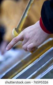 Hand in the process of serving soup