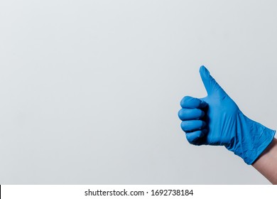 hand in a protective medical glove. protective measures during coronavirus. hand in a medical glove shows like. importance of protective measures in the epidemic of coronavirus covid-19.good prognosis - Shutterstock ID 1692738184