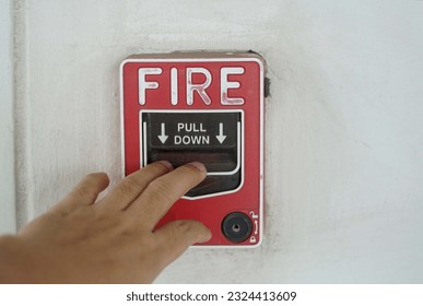 A hand was pulling down the fire call to fire alarm.