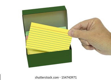 Hand Pulling Out Brightly Colored Blank Index Card From Box/ Isolated On White/ Horizontal Shot