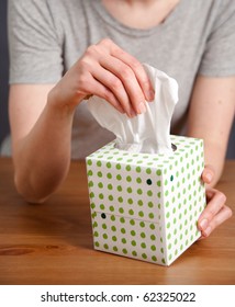 Hand Pulling Tissue Out Of Box