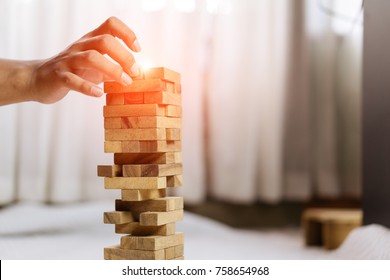 Hand Of Pulling Wooden Block Before Fail On Building Tower At Home And Drape Change, Choice Business Risking Dangerous Project Plan Failure Construction
