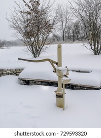 Hand Pump Buried In The Snow