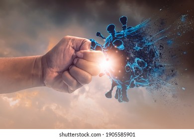 Hand punched fight attack to coronavirus,concept of fighting corona Virus or covid 19,exercise, health care, social distancing, innovations, vaccine and drug development, medicine and research. - Shutterstock ID 1905585901
