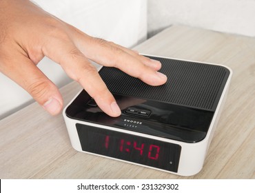 Hand Push An Alarm Clock  