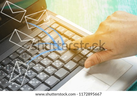 Hand push enter on laptop to send email for business.