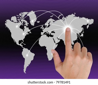 hand pushing a button on a touch screen interface in wide world.
