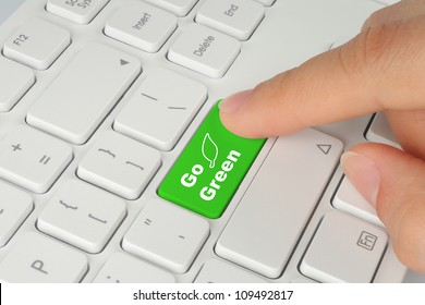 Hand Pushing Go Green Button On Keyboard