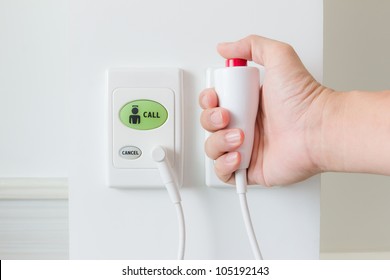 hand pushing nurse call button - Shutterstock ID 105192143