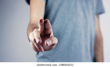 Hand pushing on a touch screen. - Shutterstock ID 1380424211