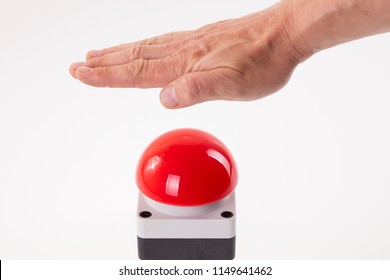 Hand Pushing A Red Buzzer