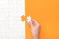 Hand Put The Last Piece Of Jigsaw Puzzle. Complete The Mission. Business Concept. 