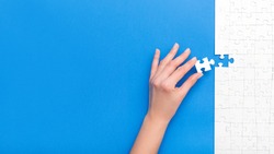 Hand Put The Last Piece Of Jigsaw Puzzle. Complete The Mission. Business Concept. 