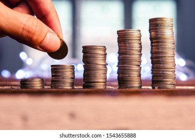 Hand put money   stack of coins, Financial, and Growth money concept. - Shutterstock ID 1543655888