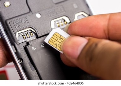 Hand Put Sim Card To The Sim Card Tray