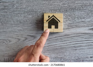 Hand Put Wooden Cubes To Make House. Build A Dream House, Ideal House, Property Concept.