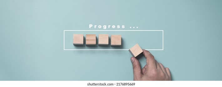 Hand putting and array wooden cube stacking for job and technology progress update concept.