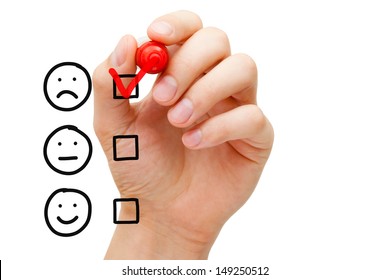 Hand putting check mark with red marker on poor customer service evaluation form.