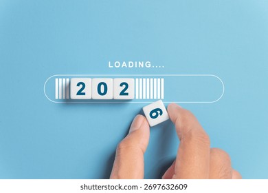 Hand putting dice for loading progress from 2025 to 2026 to countdown merry christmas and happy new year concept. - Powered by Shutterstock - Get 15% off with code: PIKWIZARD15