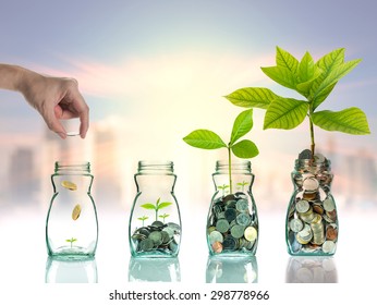 Hand putting mix coins and seed in clear bottle on cityscape photo blurred cityscape background,Business investment growth concept - Shutterstock ID 298778966