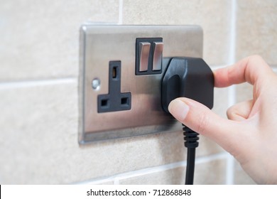 Hand Putting Plug Into Electricity Socket - Shutterstock ID 712868848