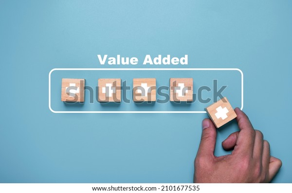 Hand\
putting plus sign which use download style which mean value added ,\
positive thinking and personal development\
concept.