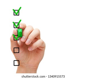 Hand Putting Three Check Marks With Green Marker On Blank Customer Survey Checklist On Transparent Glass Board. 