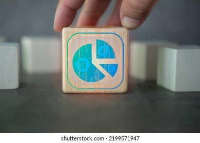 Hand Putting Wood Block With Icons Of Circle Graph Showing Market Share Portion On Wooden Cube Blocks, Pie Chart