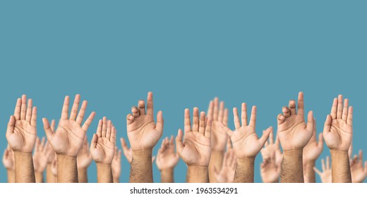 A Lot Of Hand Raised Up To The Air Isolated Blue Background. Raise Your Hand To Vote For The Majority Of Votes Election Of The Leader Of The Country.