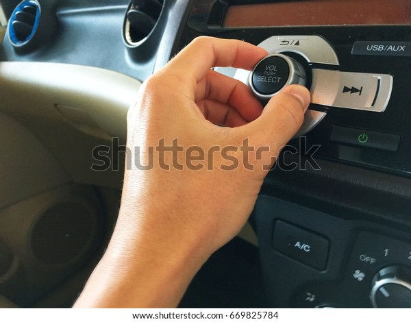 hand
Reach out to adjust the audio controls in the
car.