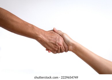 Hand reaching down to another hand, helping concept. Isolated, on white background.